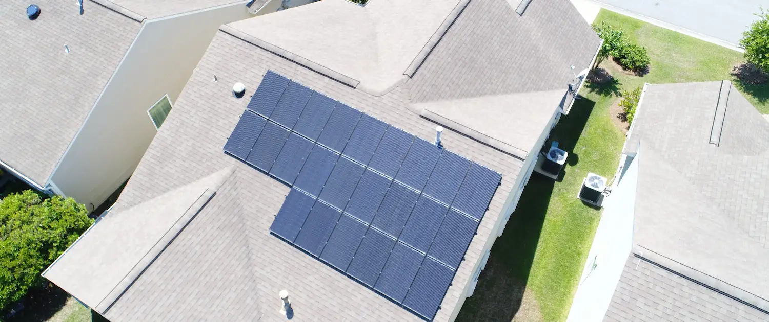 solar-panels-installed-on-house-roof-in-residential-neighborhood