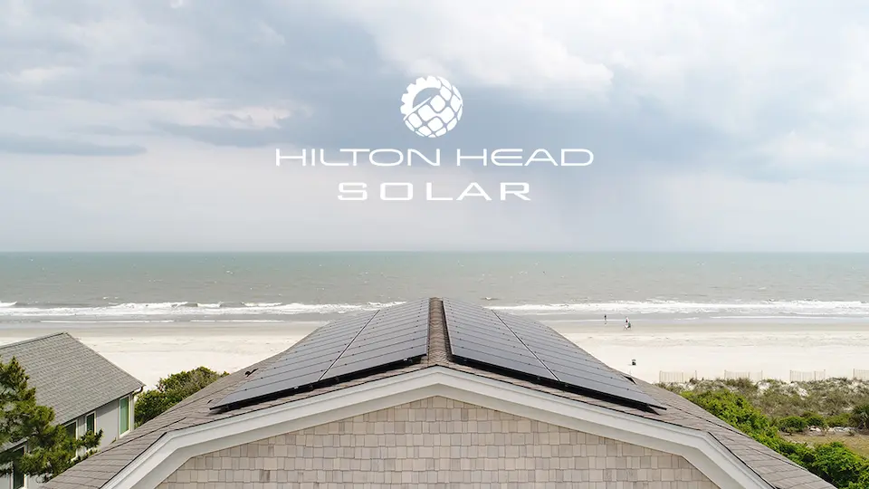 hilton-head-solar-panels-on-a-roof-with-ocean-view-and-cloudy-sky